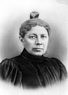 an old black and white photo of a woman with a crown on top of her head