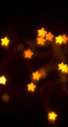 some yellow stars are glowing in the dark