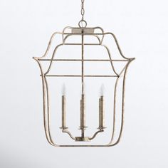 a hanging light fixture with two candles