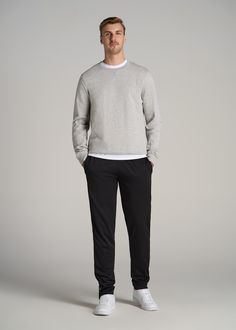 About Our Tall Men's Pants These men's tall athletic pants are a classic take on an athleisure essential. When it comes to athleisure, a good fit is key. You need something that's comfortable enough to relax in yet capable enough to work out in – but as a tall guy, it can be hard to find options that work for your height. You either have to compromise on a baggy fit or settle for lengths that are way too short. Not anymore. We know how hard it is to find quality styles when you're tall, which is Mens Winter Athletic Outfits, Male Athleisure Outfits, Tall Slim Men Outfit, Mens Sweat Pants Outfit, Mens Outfits Athletic, Tall Slim Men Fashion, Men’s Athletic Fashion Outfits, Tall Guy Fashion, Tall Man Outfit Men Styles