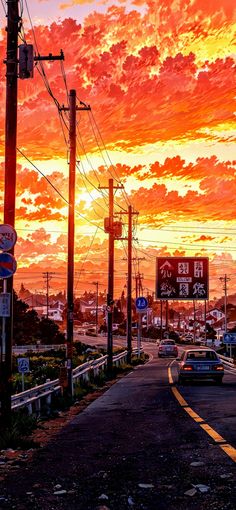 an orange and red sunset over a street with cars driving down the road in front of it