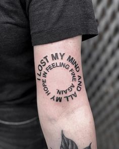 a man with a tattoo on his arm that says lost my mind and feeling free