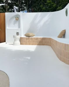 an outdoor area with potted plants and vases