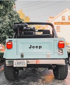 a jeep parked in front of a house