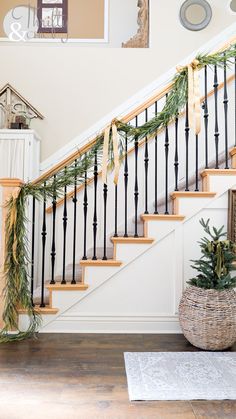 Christmas entryway decor, holiday home decorating ideas, festive entryway styling, Christmas greenery decorations, gold frame wall decor, cozy holiday entryway, budget-friendly Christmas decor, DIY Christmas entryway ideas, wicker basket storage decor, bottle brush trees holiday decor, elegant Christmas candles, rustic Christmas entryway ideas, stylish holiday home decor, farmhouse Christmas entryway, welcoming holiday home ideas, vintage gold frame styling, Christmas ribbon decorations, entrywa