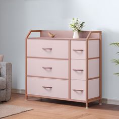 a pink chest of drawers in a living room