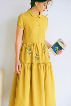 ❤ Item description: - A lovely, unique and elegant dress with little flower embroidery motifs. - Material: linen, button, embroidery threads. - Environmentally friendly. - This dress is very useful, go with any outfit, that can be used to go to school, go out, go shopping.    It is a perfect gift for yourself or your beloved.  ❤ Care instructions:     The best way to wash embroidery cloth is to put it in soapy water (with a mild detergent and cold water at 86 ºF/30oС) for 20 minutes. Try to not wash the item with other clothing that might cause damage, such as zippers, buttons or different colors. You wash it by hand, and if you have dirty patches on your garment, you can gently rub them, it's best not to rub directly against the embroidery. Rinse with clean water. Then, hanging your cloth Flower Embroidery Clothes, Festive Yellow Dresses With Floral Embroidery, Embroidered Short Sleeve Midi Dress For Garden Party, Embroidered Midi Dress With Short Sleeves For Garden Party, Short Sleeve Embroidered Midi Dress For Garden Party, Cottagecore Embroidered Dress For Garden Party, Embroidered Linen Midi Dress For Spring, Spring Embroidered Linen Midi Dress, Embroidered A-line Dress For Garden Party