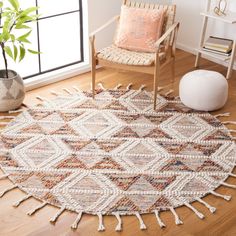 a living room area with a rug and chair