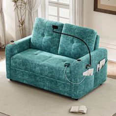 a blue couch sitting on top of a white rug