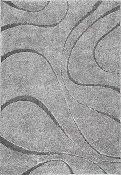 a gray rug with wavy lines on it