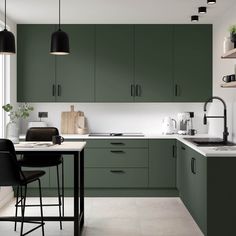 a kitchen with dark green cabinets and white counter tops, black bar stools and hanging lights