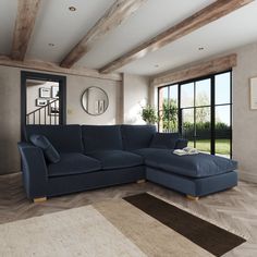 a living room with a large blue couch