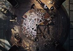 an overhead view of a large clock in the middle of a room