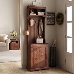 a wooden grandfather clock sitting in the corner of a room next to a white couch