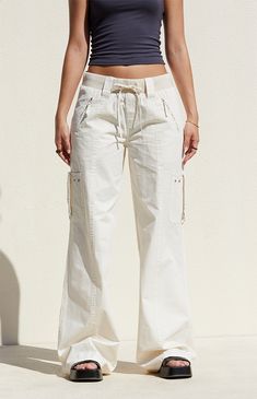 Step out in style with the Bone Low Rise Baggy Flare Pants from PacSun. Designed for both comfort and utility, these pants feature a low-rise fit, ribbed drawstring waistband, and zipper side pockets. Complete with cargo strap pockets on the legs and flared leg openings, they offer a trendy, relaxed baggy look for any occasion. Cool Bottoms For Women, Cute Khaki Pants, Light Pants, Silk Flare Pants, Pants Other Than Jeans, Relaxed Pants, Capsule Wardrobe Pants, Styles Clothing, Utility Wide Leg Cargo Jeans With Drawstring