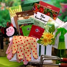 the gardening gift basket is filled with gardening supplies and garden tools, including gloves, flowers, books, seeds, seed catalogs, and more