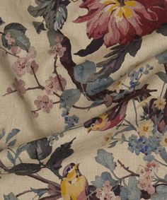 a floral print fabric with birds and flowers on it