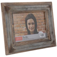 an old wooden frame with a woman's face on it