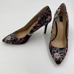 - G.I.L.I. Nwot / Nwob Alecia Navy Floral Embroidered Point Toe Stiletto Pumps - So Elegant And Unique! Really Lovely, Pics Don’t Do Them Justice - Out Of Production, Hard To Find - Beautiful Embroidered Floral Design - Black With Multicolored Embroidery Of Silver, Pink, Purple And Navy - Size 7.5m - Approximately 3 Inch Heel - Leather Outsole, Leather Insole, And Linen Blend Outer - New, Never Worn. They Do Have A Small Defect On The Insole Of The Left Shoe Inside The Toe. Not Visible From Outside And Could Be Easily Covered With A Toe Pad If Bothersome. Shown In Pics And Reflected In Price - Please See All Photos For Condition Of Item. - Item Is Sold As Is. - Smoke-Free Home. - Item Sho Formal Round Toe Heels With Embroidery, Elegant Formal Heels With Floral Embroidery, Elegant Floral Embroidery Heels For Formal Occasions, Elegant Floral Embroidered Heels For Formal Occasions, Elegant Floral Embroidery Round Toe Heels, Elegant Heels With Floral Embroidery And Round Toe, Elegant Fitted Heels With Floral Embroidery, Floral Embroidered Fitted High Heels, Floral Embroidered Party High Heels