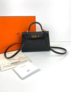 Black Kelly Bag, Hermes Mini Kelly Pochette, Black Mini Kelly, Hermes Kelly Bag Black, Hermes Mini Kelly Gold, Orange Boxes, Hermes Kelly Bag, Kelly Bag, Gold Hardware