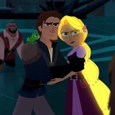 the princess and prince are dancing together in front of other people, one is holding a frog