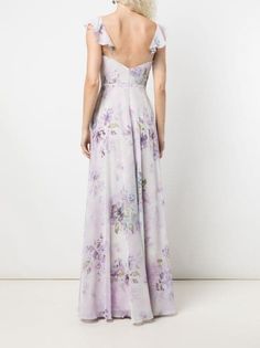 the back of a woman wearing a purple floral dress