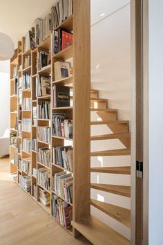 the bookshelf is full of books and magazines