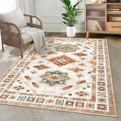 an area rug in the middle of a room with a chair and potted plant