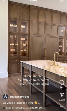 a kitchen with wooden cabinets and white marble counter tops, along with an appliance