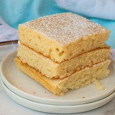 three pieces of cake sitting on top of a white plate