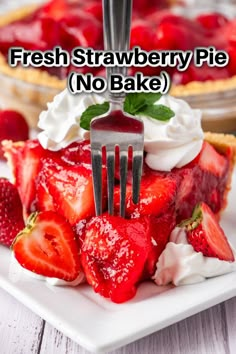 fresh strawberry pie with whipped cream and strawberries on the top is served with a fork