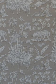 the wall paper is decorated with animals and plants in white on grey background, as well as an animal - like pattern