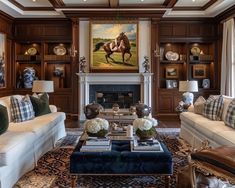 a living room filled with furniture and a painting on the wall