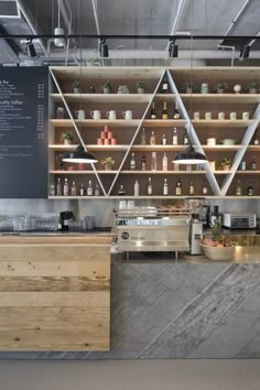 an industrial kitchen with marble counter tops and shelves