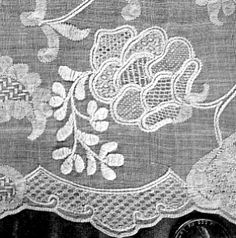 an old black and white photo of a table cloth