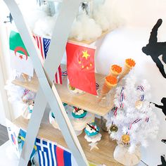 the shelves are decorated with paper and other decorations, such as cupcakes or cakes