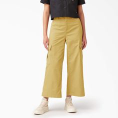 Dickies Women’s Regular Fit Cargo Pants offer both classic style and unmatched utility. These functional, no-fuss work pants have a refined style, featuring tunnel belt loops, a contoured waistband, and a cropped length, with a wide-leg opening. The pants have a zip fly and a hook and eye closure, with dual cargo pockets, front slash pockets, and back welt pockets. Constructed with one of our signature blends of brushed twill, cotton, and polyester, these regular fit pants provide soft comfort a Womens Dickies, Dickies Cargo Pants, Uniform Style, Fit Cargo Pants, Cropped Cargo Pants, Dickies Workwear, Dickies Women, Pullover Cardigan, Uniform Fashion