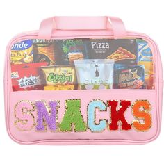 a pink lunch bag filled with snacks on top of a white background and the words snack's spelled out in multicolored letters