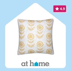 a pillow with an image of flowers on it and the words at home above it