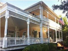 a large white house with columns and balconies