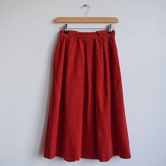 Vintage corduroy red midi skirt. Great vintage condition. Made in Weat Germany by Mondi in 80's. Two side pockets, no lining. 50% cotton 50% polyester. Full skirt fit. Triangle details at the top. Originally women's size XS depending on desire fit but please check measurements carefully. Waist 60cm=23'5 Total length 68cm=26'5 Vintage Corduroy Skirt For Fall, Retro Red Midi Skirt, Red Flowy Vintage Skirt, Vintage Flowy Red Skirt, Vintage Corduroy Skirt, Vintage Red Tiered Skirt, Vintage Red Knee-length Skirt, Red Midi Skirt, Red Midi