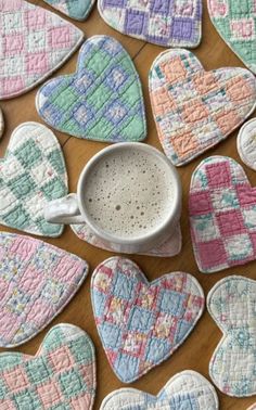 some heart shaped cookies and a mug on a table