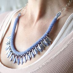 The Dagger Fringe Necklace design is something unique! This Advanced Beginner level project is made with the 8 cord spiral braid with superduos braided right into the braid. The fringe is created using both 2-hole Czechmate(tm) daggers and one hole daggers to achieve this lush, rich design. Finished length is 20”-22” and can be adjusted by either the chain length or the braid length. The ends are finished off with a braided loop ending. Complete Instructions and all supplies are included except Braid Length, Spiral Braid, Rich Design, Fringe Necklace, Necklace Design, The 8, Necklace Designs, Chain Lengths, Chain Length