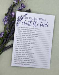 a purple flower next to a white paper with the words 20 questions about the bride