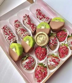 a box filled with chocolate covered strawberries and kiwis on top of each other