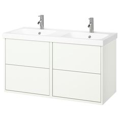 two white sinks sitting next to each other on top of a wall mounted sink cabinet