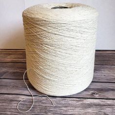 a ball of yarn sitting on top of a wooden table