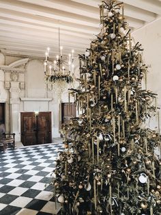 a decorated christmas tree in the middle of a room