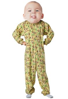 a baby wearing pajamas and making a funny face