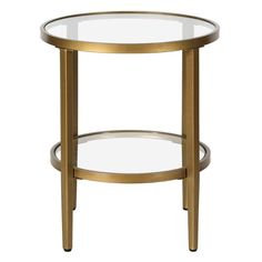 a round glass table with metal legs and a gold frame around the top, on a white background